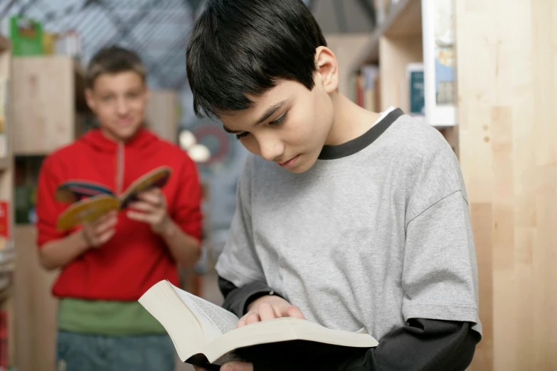 a  and girl looking at a book