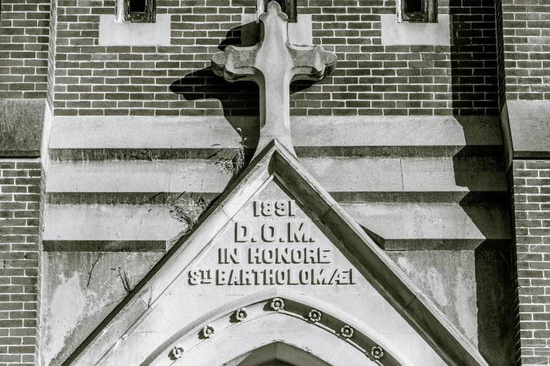 an old style church with a large cross on the front