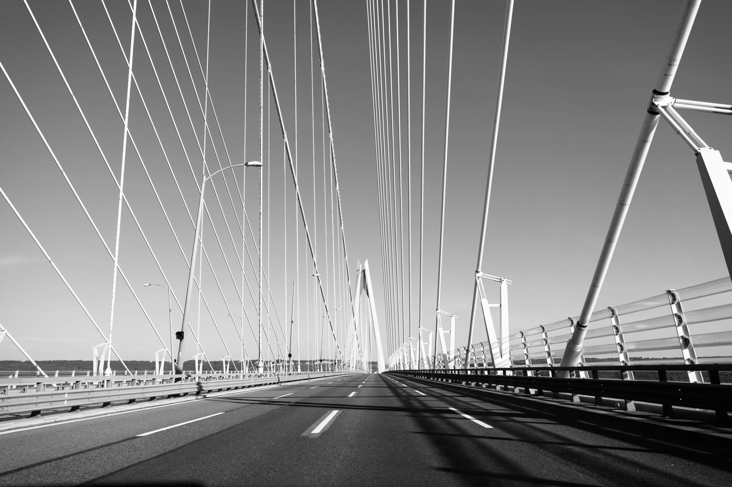 the road is empty and with wires hanging above it