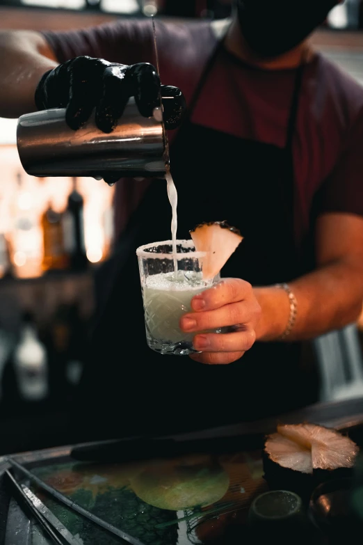 man making drink in a glass for himself