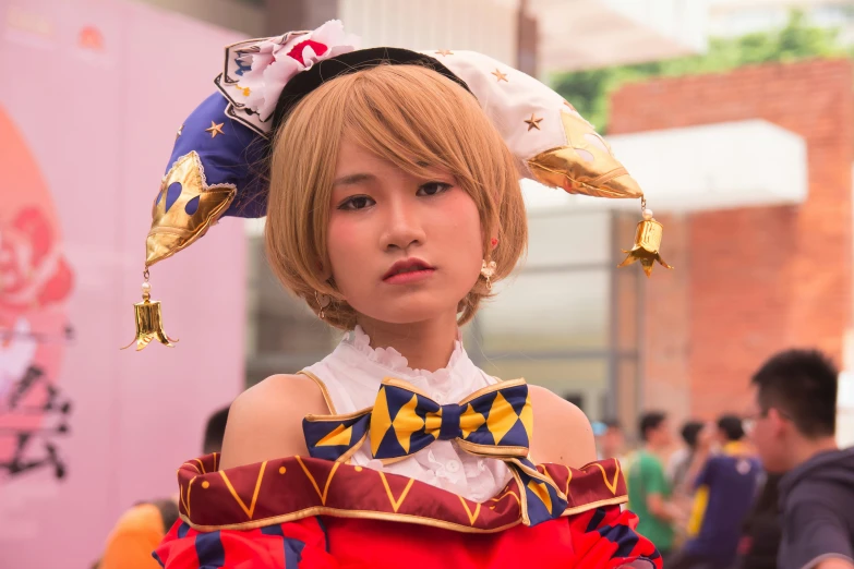 a close up of a young woman in a costume