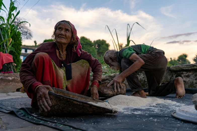 two women are working in a large pot