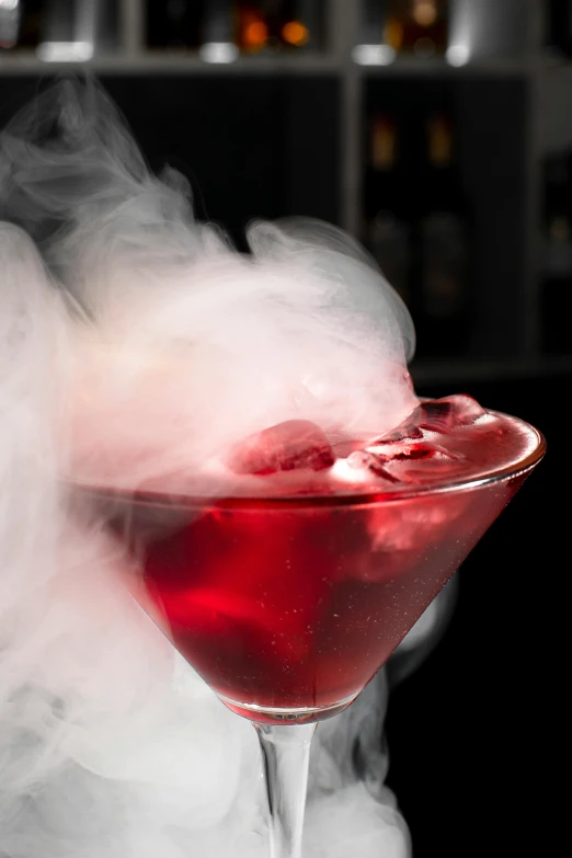 red liquid and steam coming from a glass