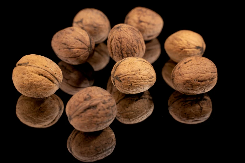 several walnuts are laying on top of each other