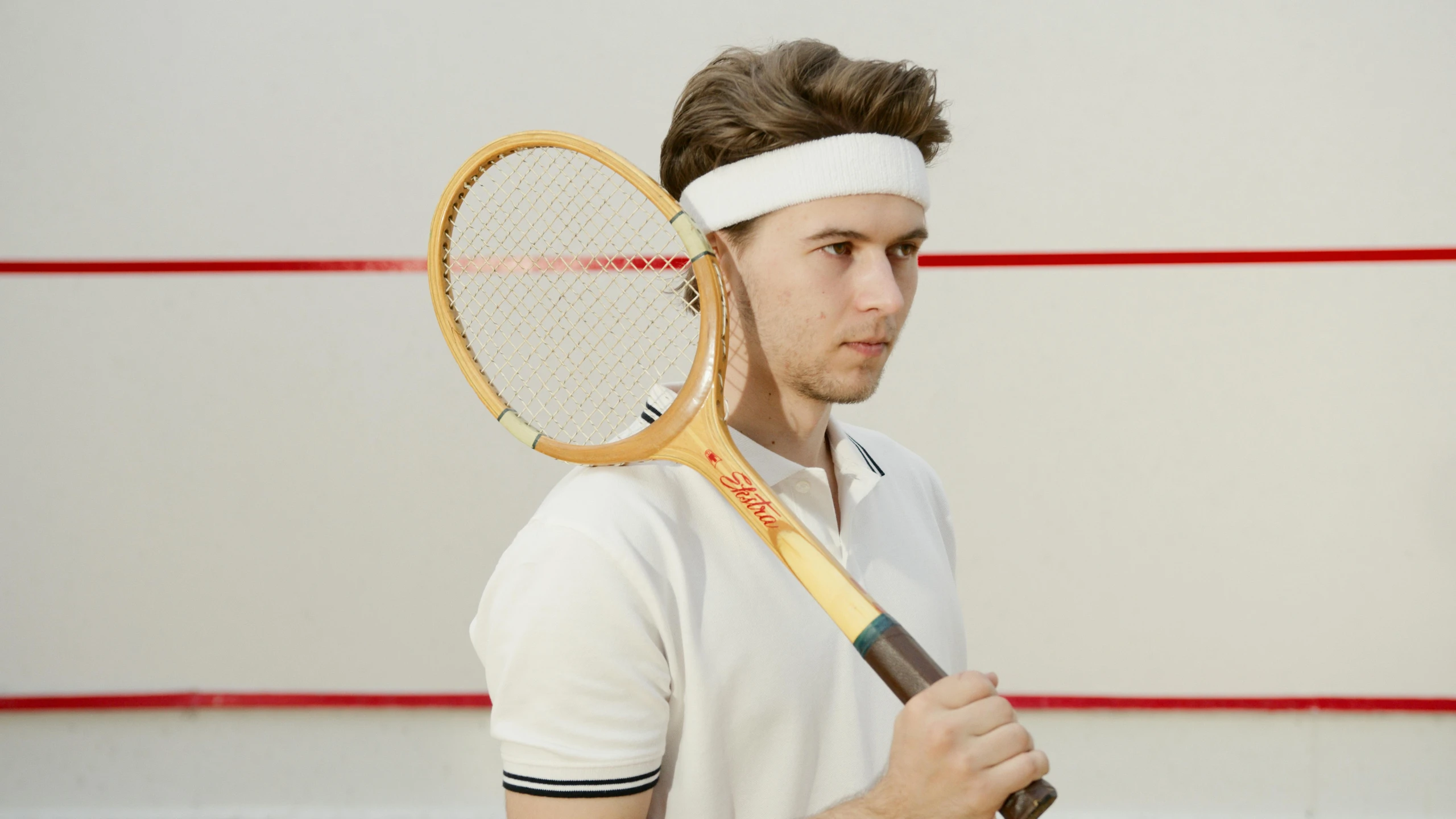 a tennis player holding a racket in his hand