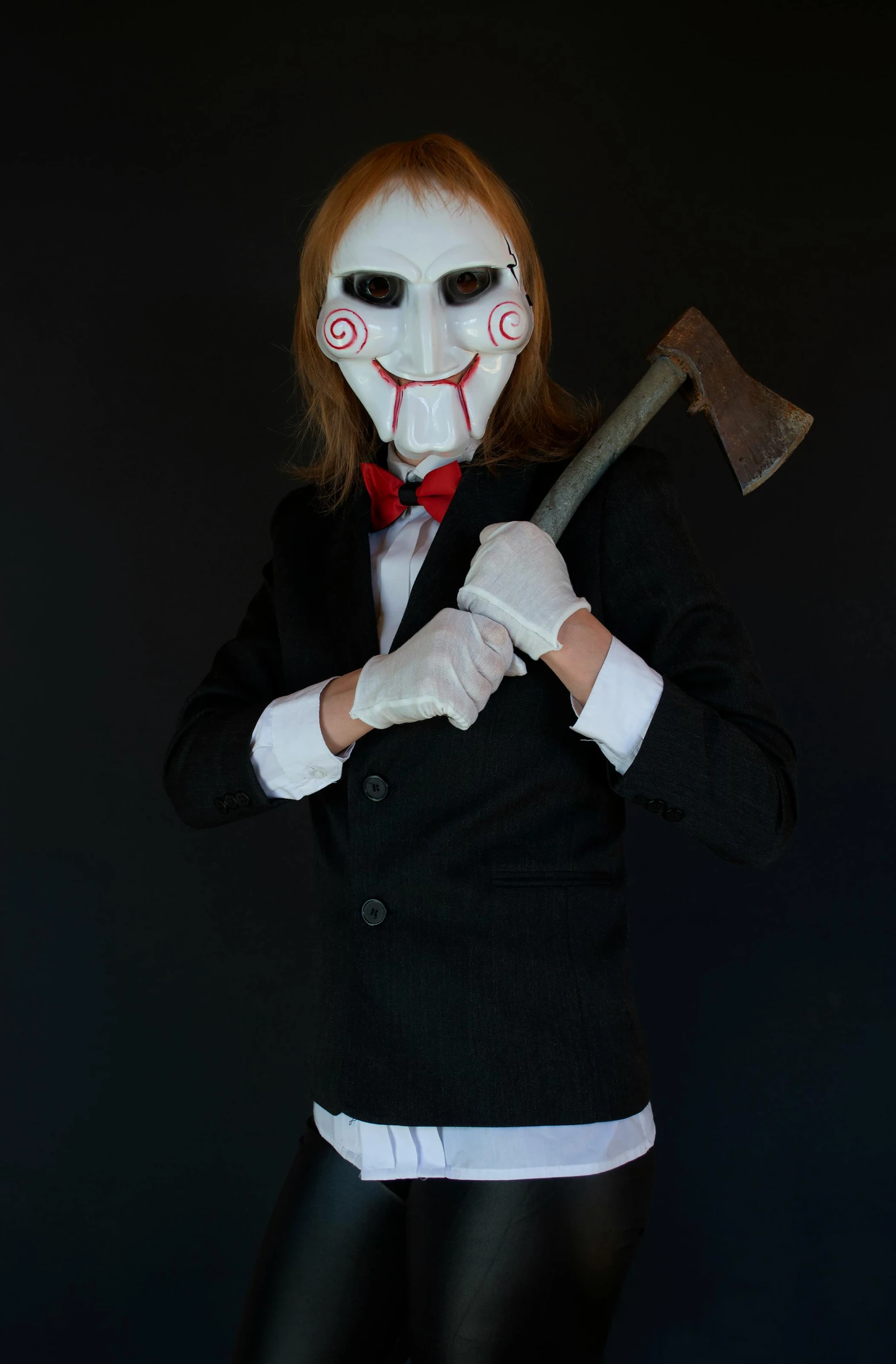 a creepy costumed woman with a long knife