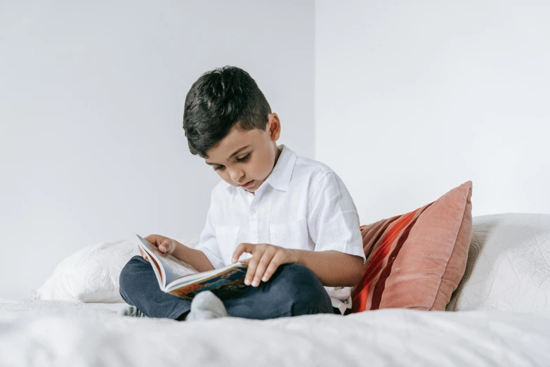 a  is reading a book in bed