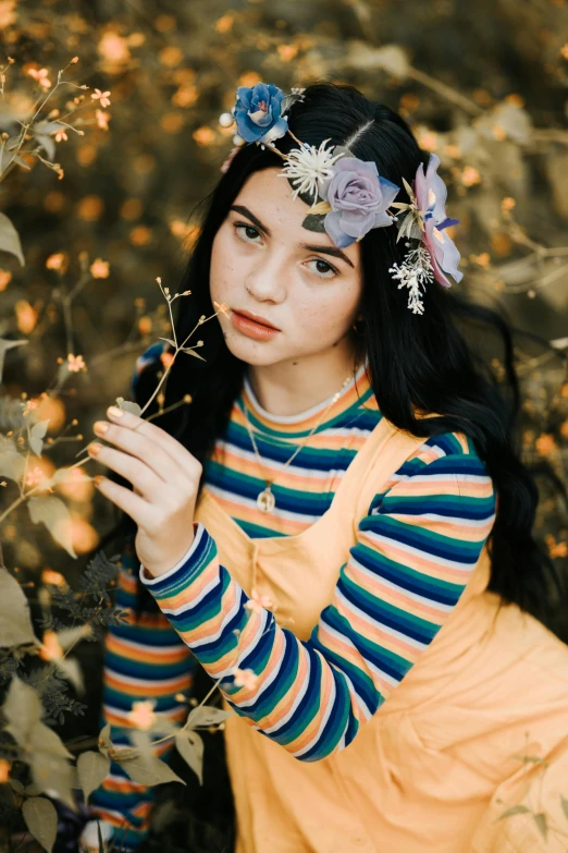 the girl wearing an interesting headband has long dark hair