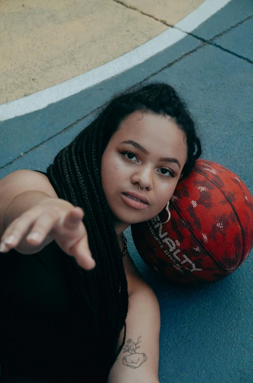  laying on the ground next to a basketball