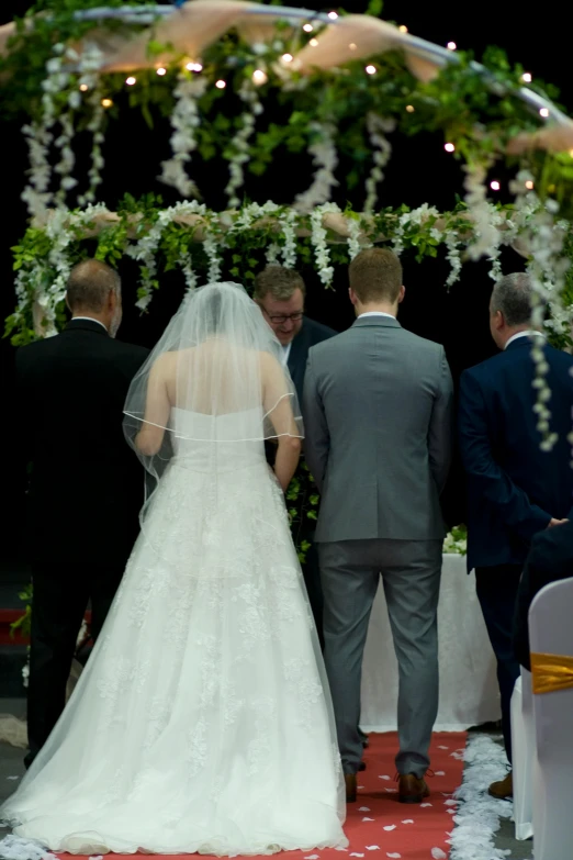 a man and woman walking down the aisle