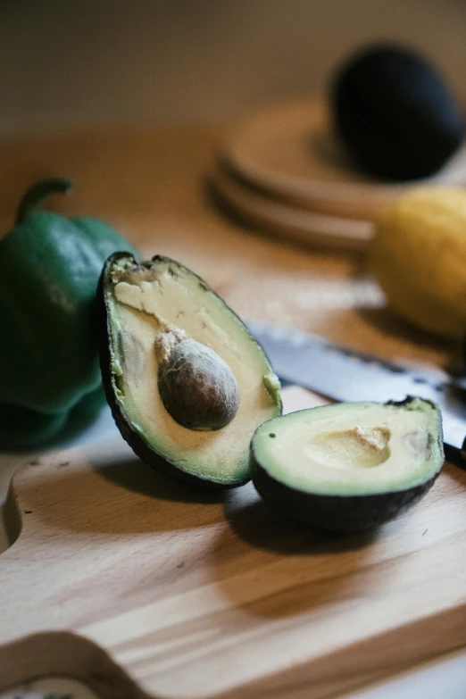 a close up of fruit on a wooden  board