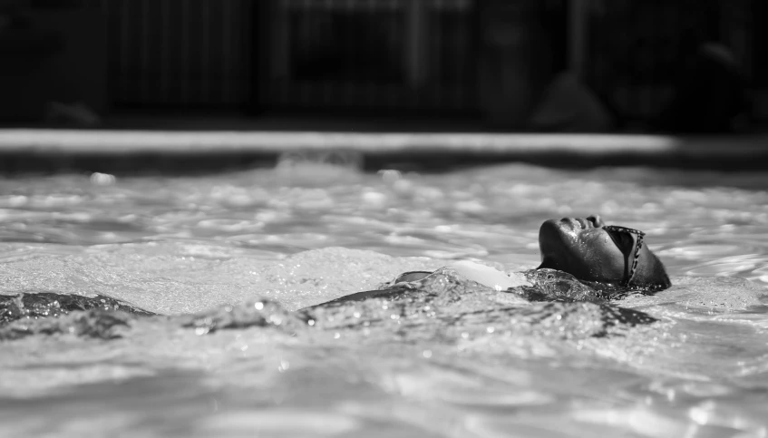 a baseball glove is in a pool with water