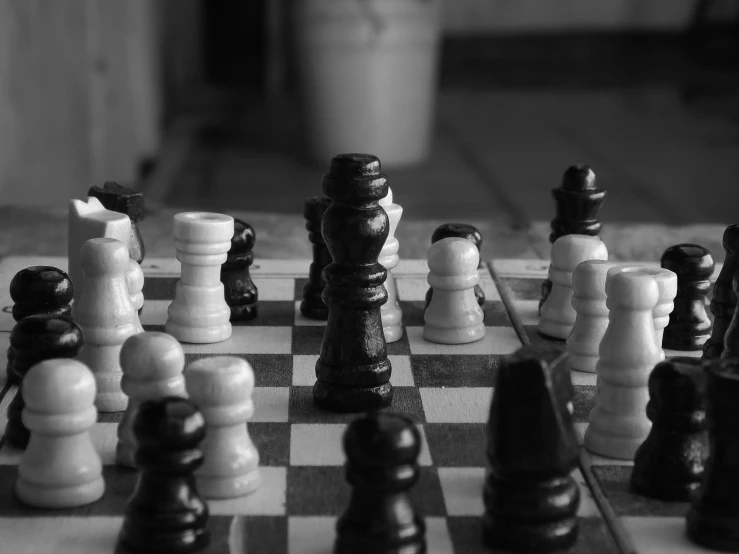 several chess pieces lined up on the chessboard