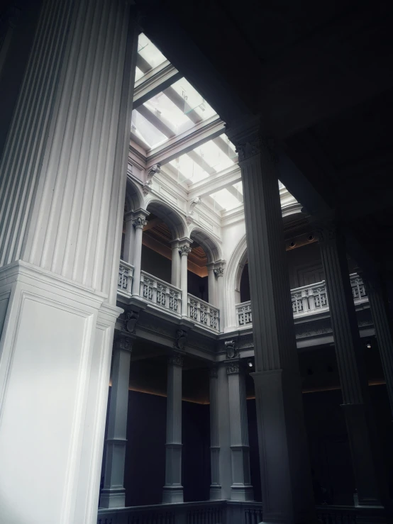 the interior of a very large building with multiple columns