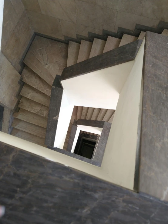 a stairway cased that has a door open to look down