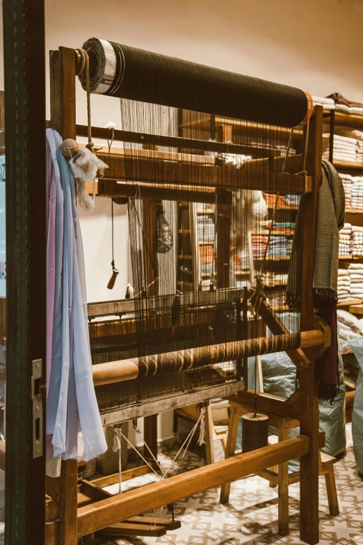 a long loom with a blue towel hanging next to it