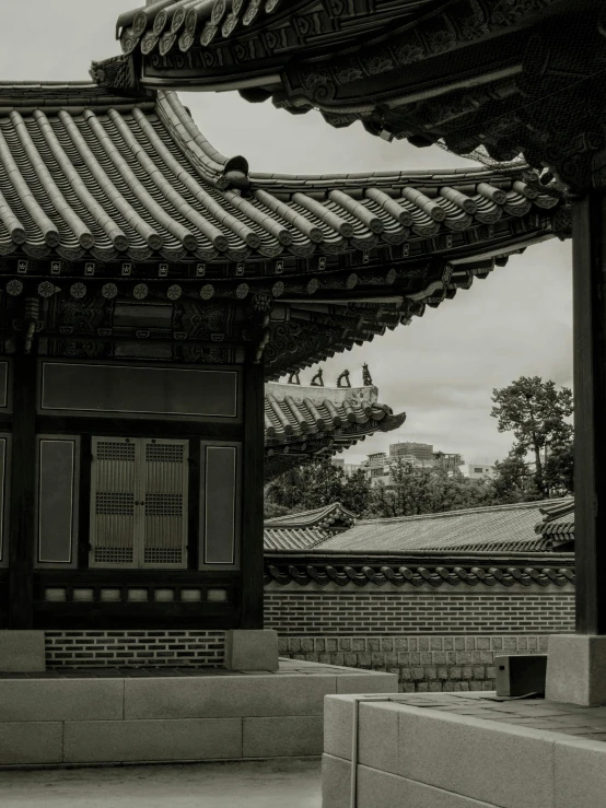 a building with roof tops and doors in a courtyard