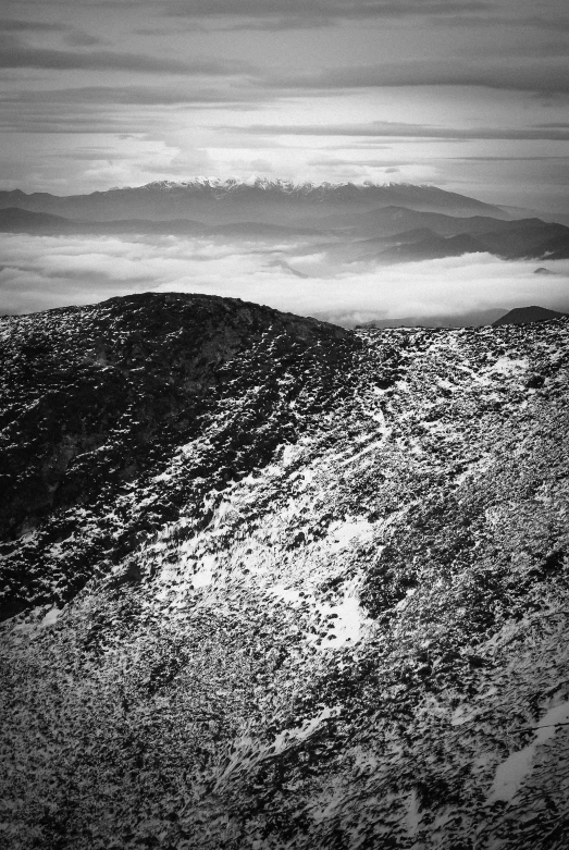 a hillside is covered in small, dark rocks