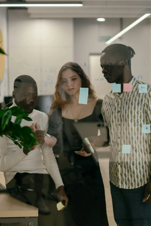 people having a discussion in an office area