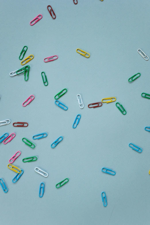 lots of little pins lying on a table