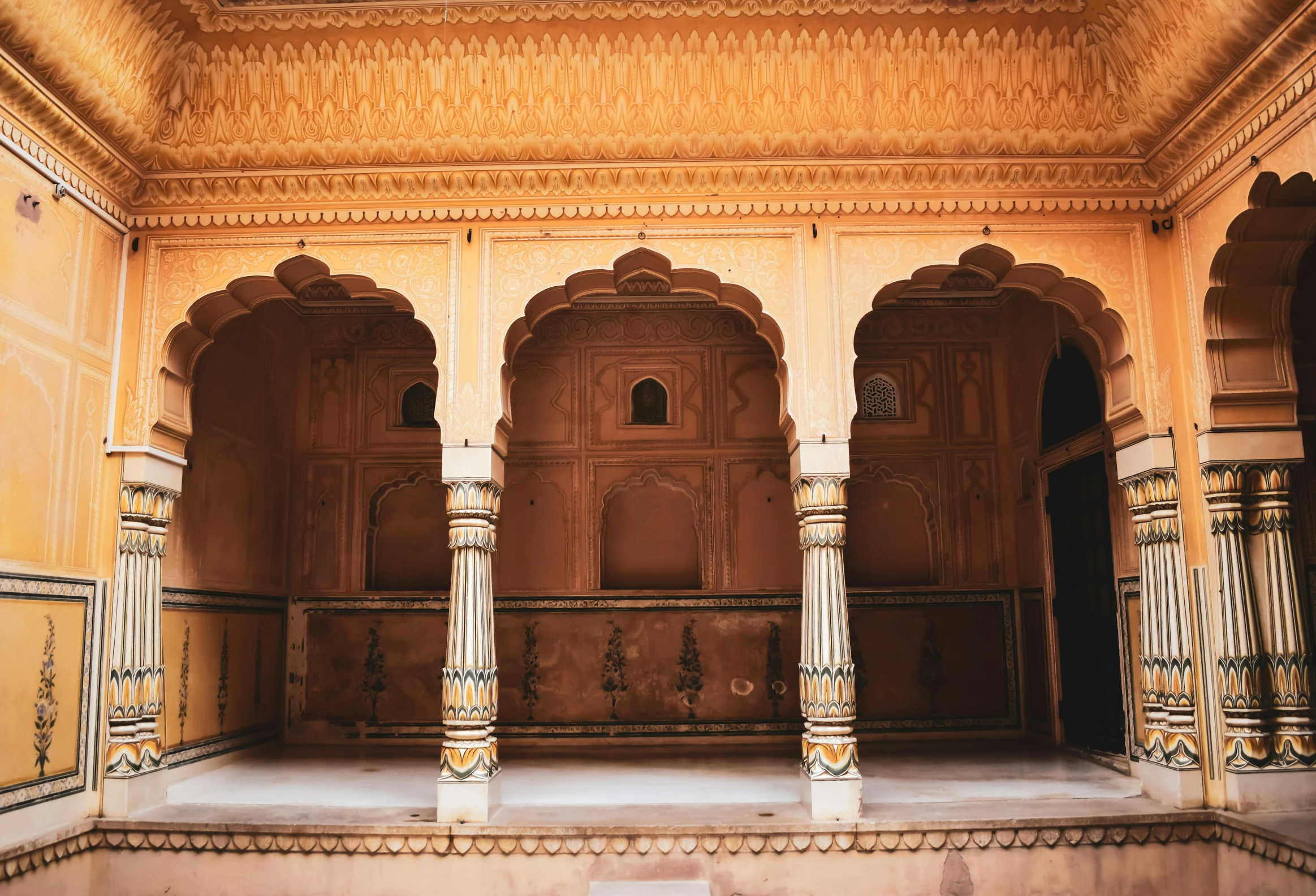 several pillars in an old building near the top