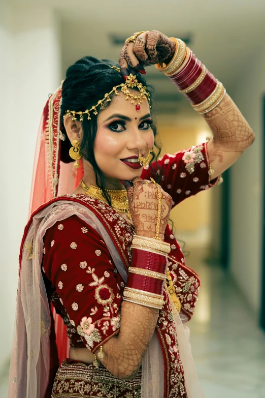 a bride with a bridal jewelry and costume in traditional indian garb