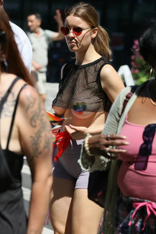 a girl in her underwear is walking among others