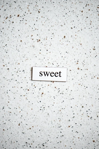 a piece of paper that has the word sweet on it