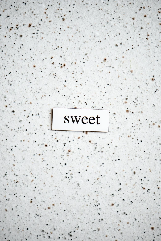 a piece of paper that has the word sweet on it