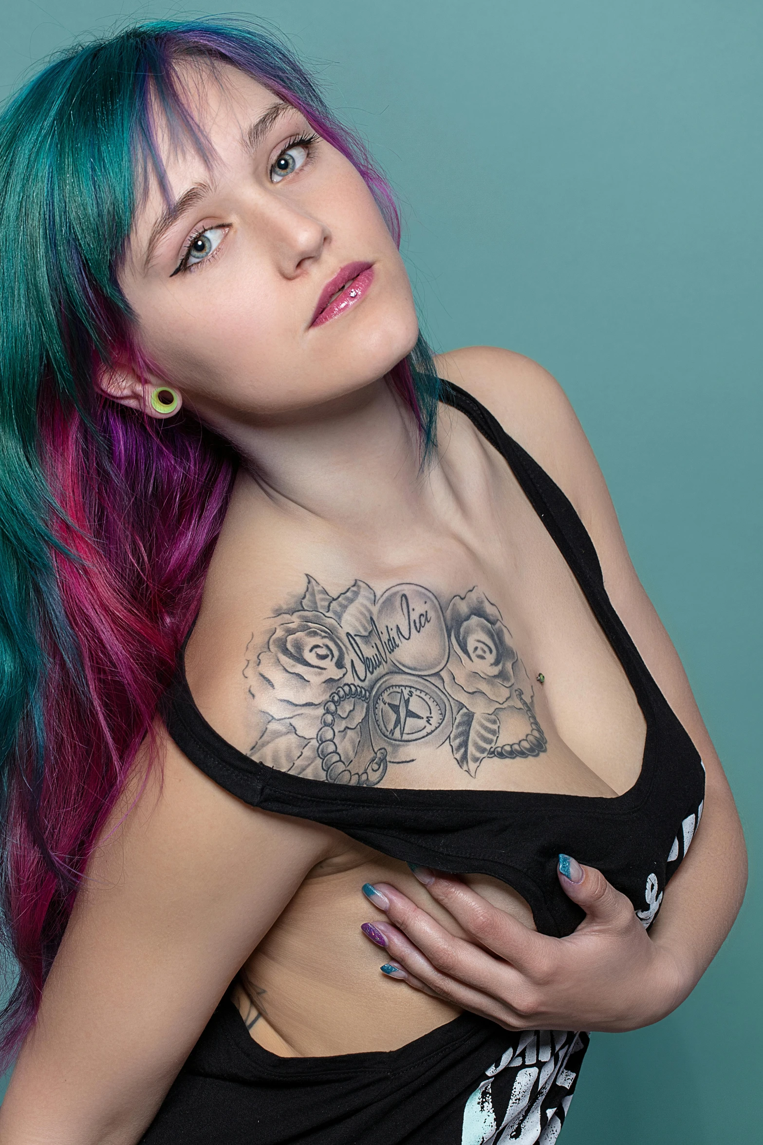 a girl with colorful hair posing for a portrait