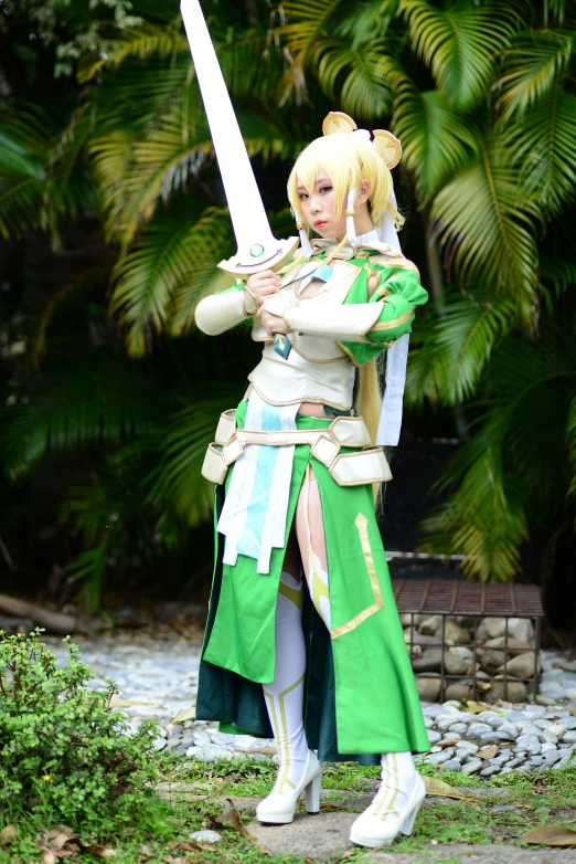 a cosplay dressed in armor holds a sword