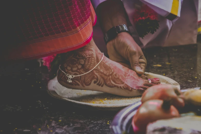 a woman who has tattoos on her legs and feet