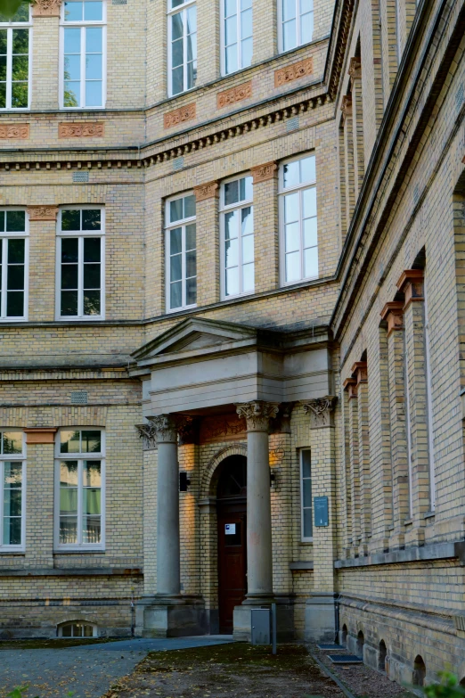 a courtyard at a large building with columns and columns