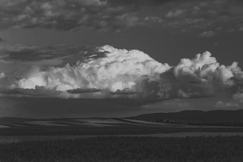 an image of the sky and clouds over a forest