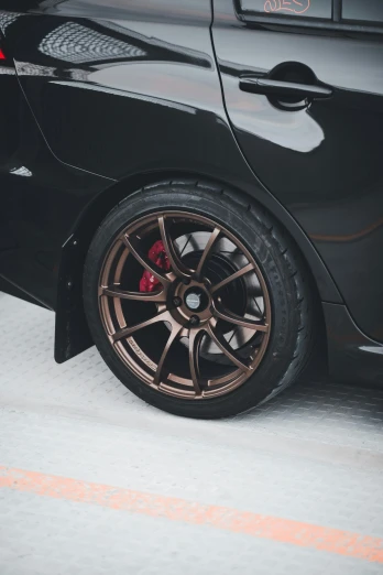 a very close up view of some very shiny cars wheels