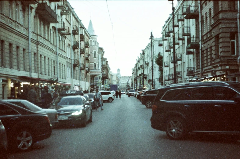 a busy street full of traffic and pedestrians