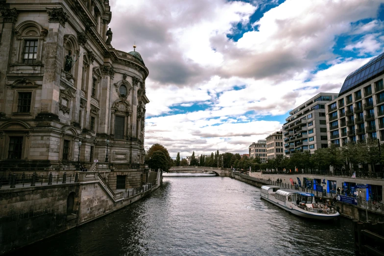 a river running through a city with tall buildings