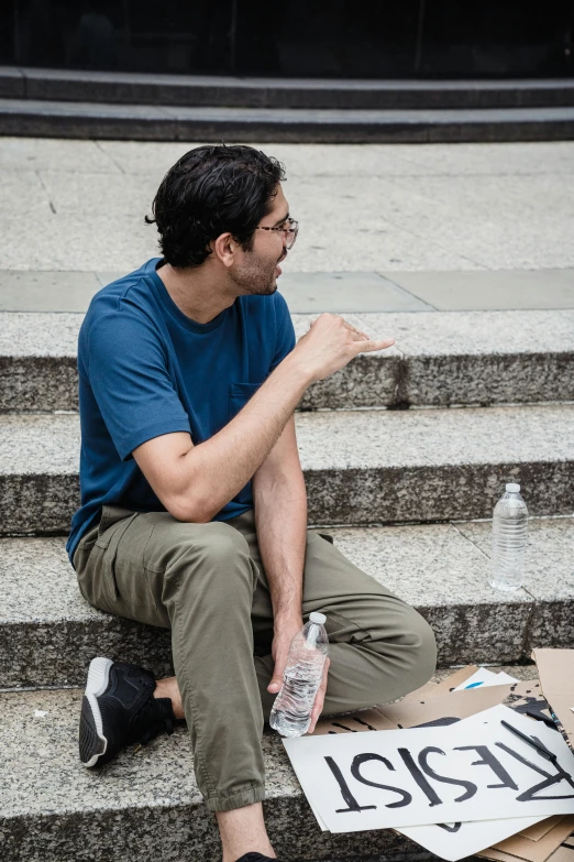 a person sitting on stairs talking to someone