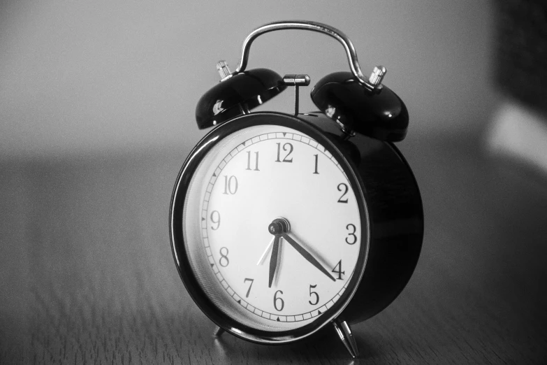 an alarm clock is sitting on a table