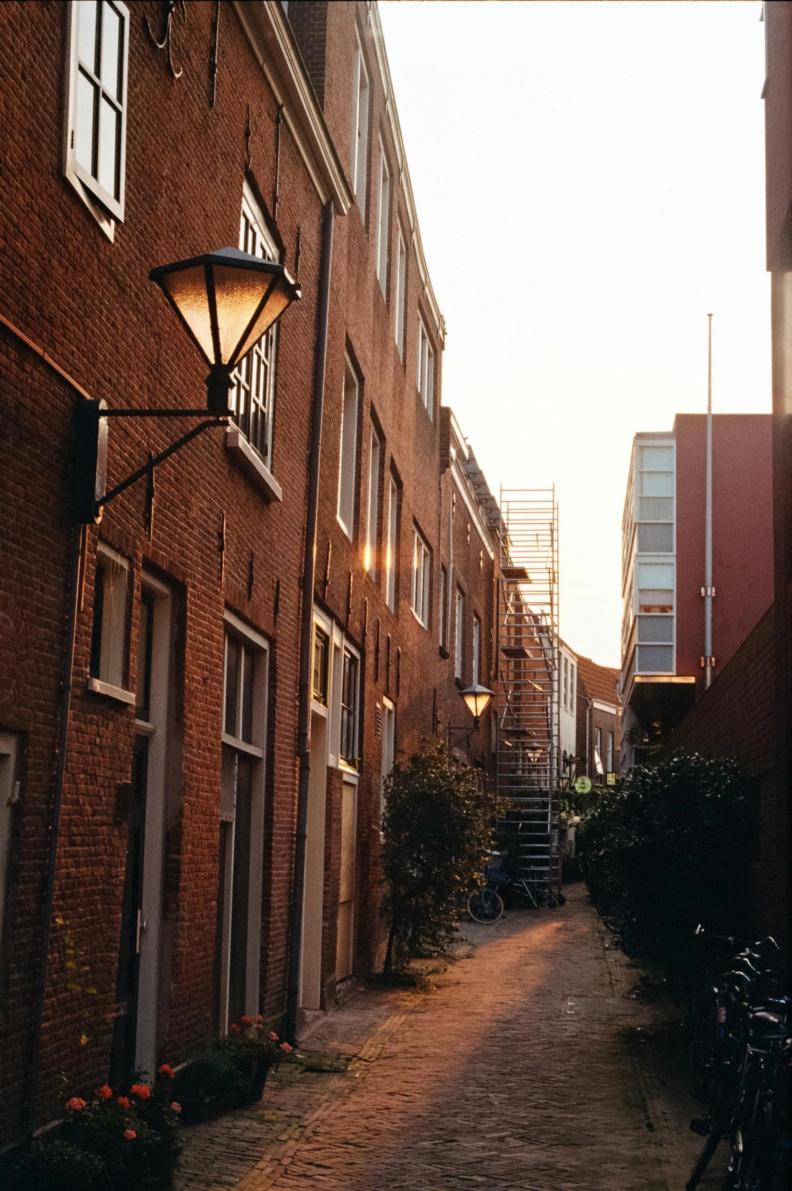 alley with brick buildings and bicycles near by