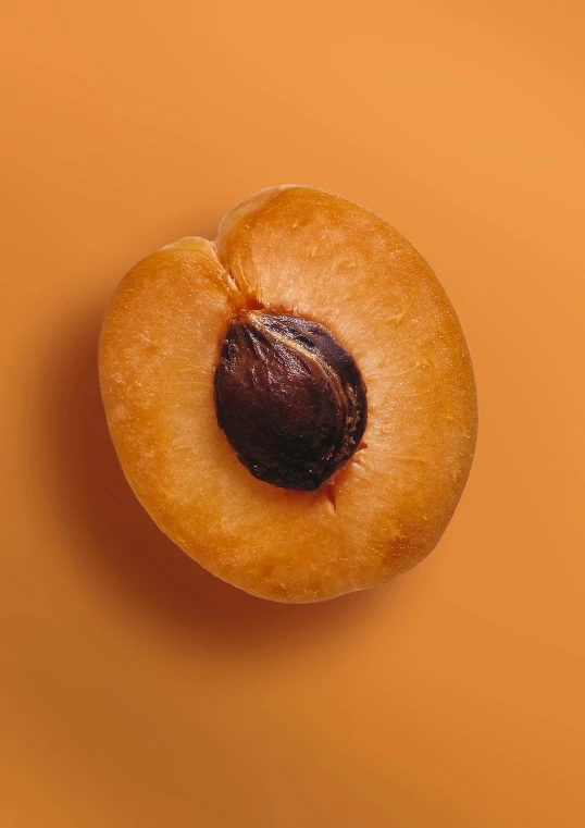 two apples are seen with orange background