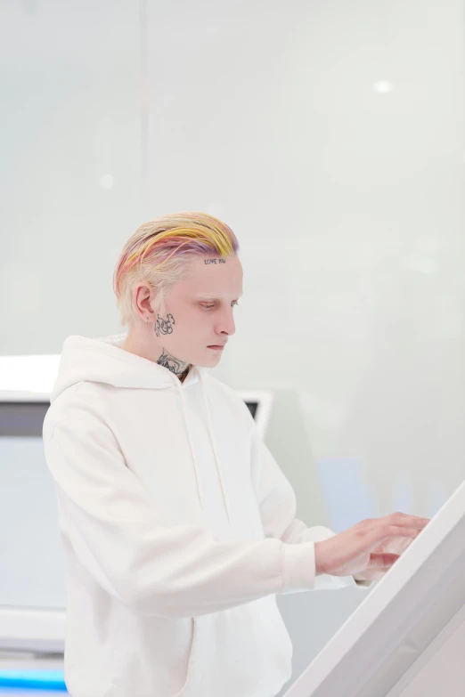 a woman wearing white on top of a ramp