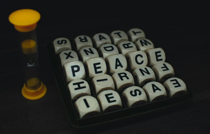 several cubes with letters spelling peace on them