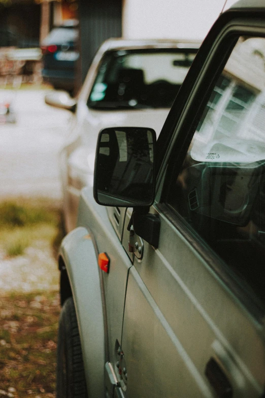 the car side mirror is visible against the parked suv