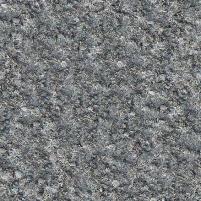an area covered in grey rocks with white speckles