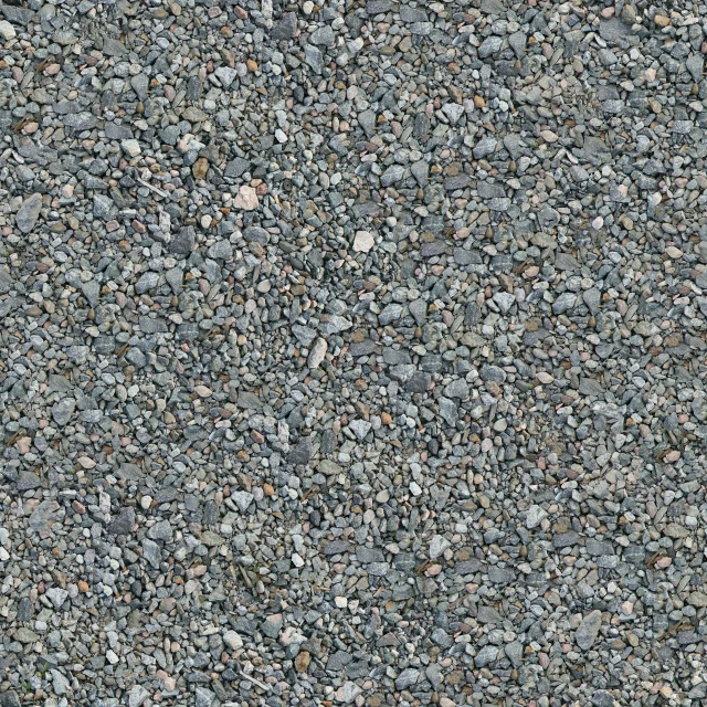 a blue and black colored cement floor with rocks