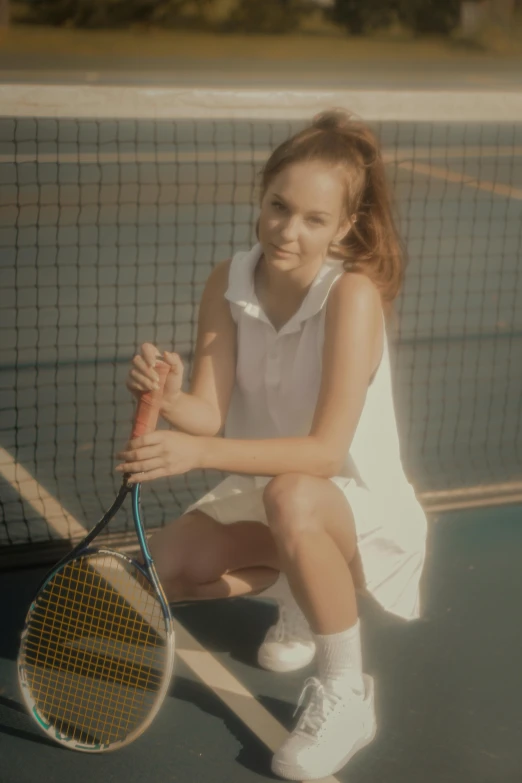 the girl is playing tennis on the court