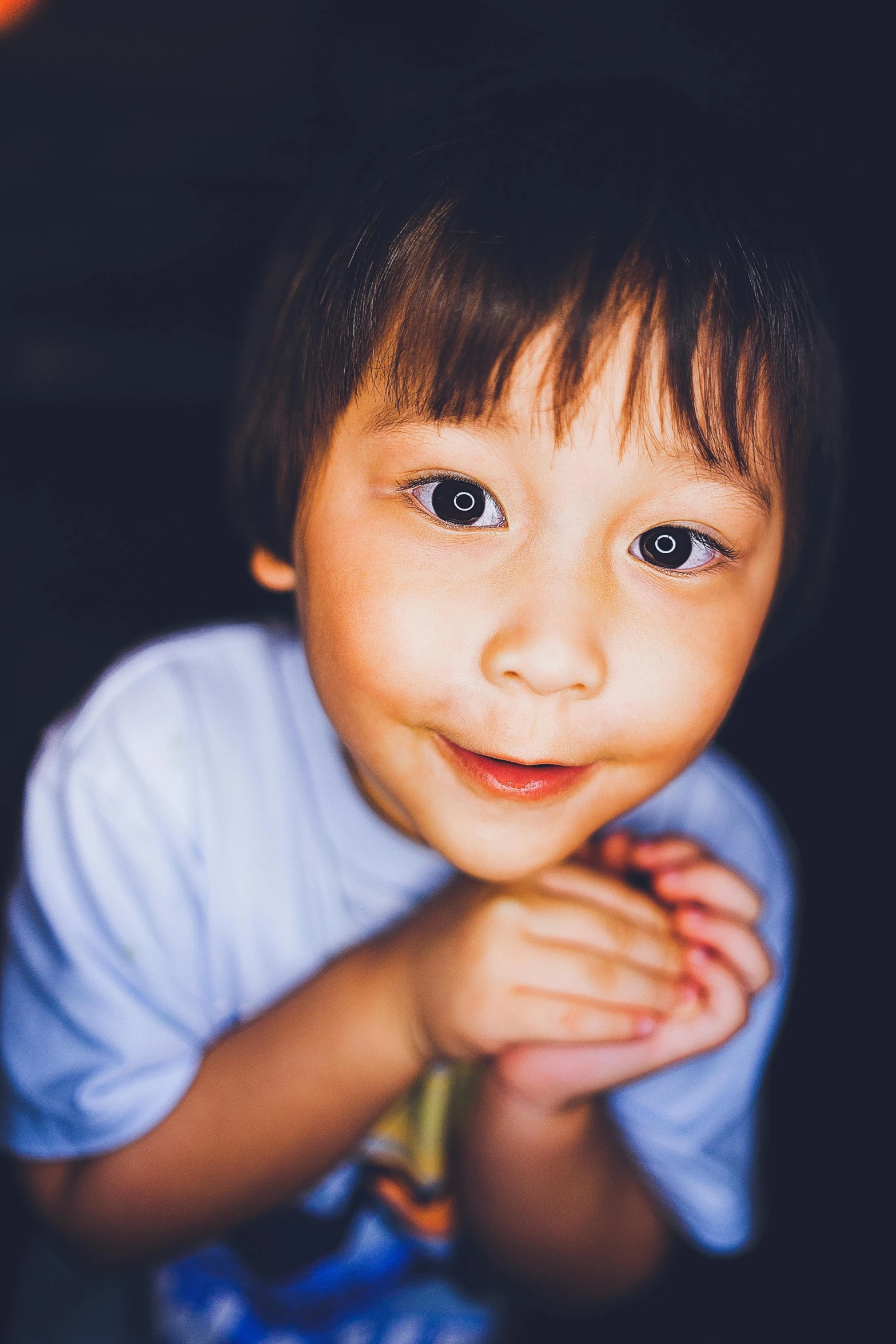 a close up of a child with big eyes