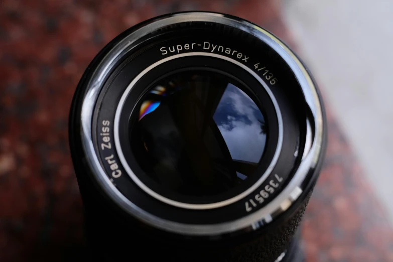 a camera lens with a small reflection in it