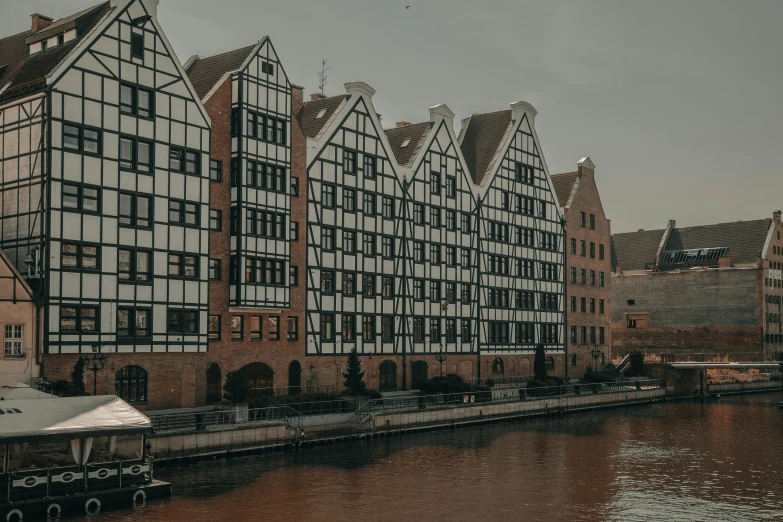 several buildings near a river in a city